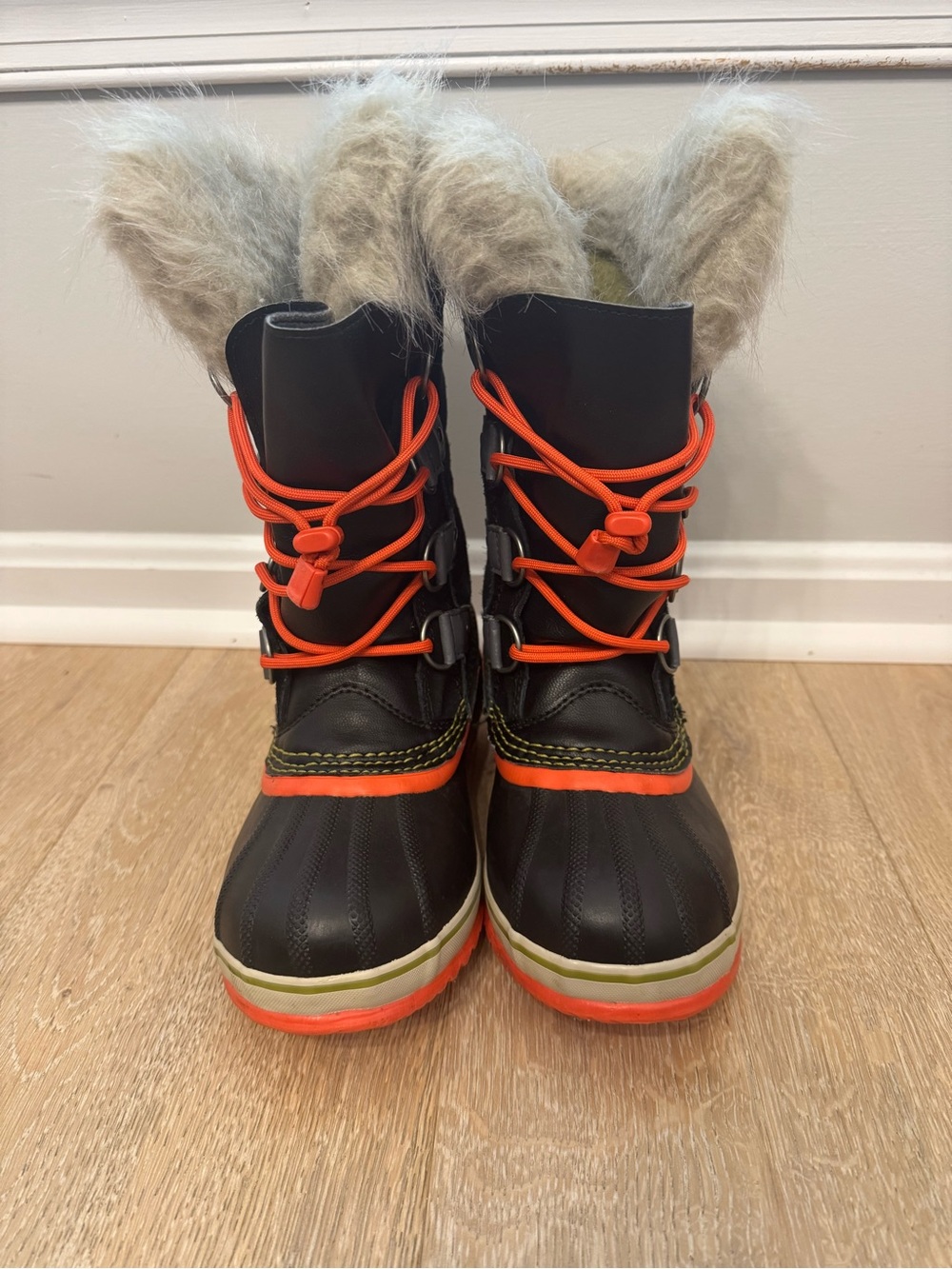 Sorel Kids Black Winter Boots with Orange Accents and Faux Fur Cuff